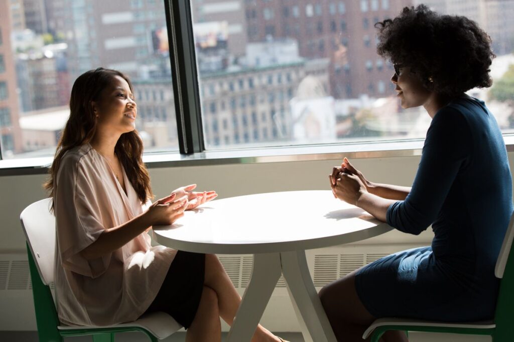 Kenyan professionals discussing Business Website vs E-commerce Website: Which One in modern office